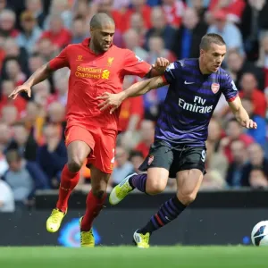 Lukas Podolski vs. Glen Johnson: Intense Battle at Anfield (Liverpool v Arsenal, 2012-13) Lukas Podolski vs. Glen Johnson: Intense Battle at Anfield (Liverpool v Arsenal, 2012-13)