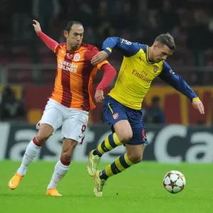 Lukas Podolski vs. Umut Bulut: A Battle in the UEFA Champions League between Galatasaray and Arsenal Lukas Podolski vs. Umut Bulut: A Battle in the UEFA Champions League between Galatasaray and Arsenal