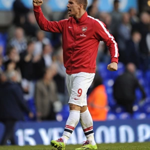 Lukas Podolski's Celebration: Arsenal's Victory Over Tottenham Hotspur in the Premier League, 2014