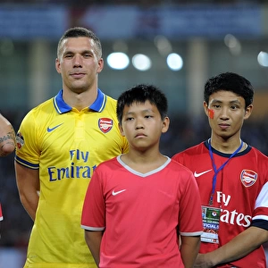 Lukas Podolski's Vietnam Adventure: The Running Man with Arsenal