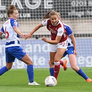 Malin Gut of Arsenal Outmaneuvers Angharad James of Reading in FA WSL Clash