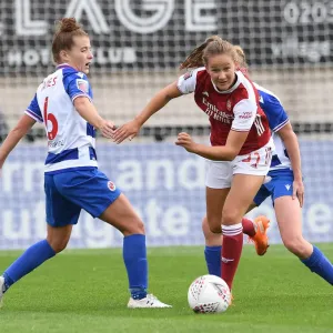 Malin Gut of Arsenal Outmaneuvers Angharad James of Reading in FA WSL Clash