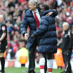 Manager Arsene Wenger celebrates the Arsenal goal with Emmanuel Eboue. Arsenal 1