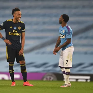 Manchester Derby: Aubameyang and Sterling Share a Moment Amidst Premier League Battle (Manchester City vs Arsenal, 2019-20)
