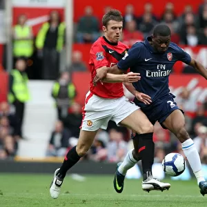 Manchester United Edge Past Arsenal: A Tight Battle Between Abou Diaby and Michael Carrick