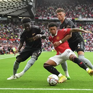 Manchester United vs. Arsenal: Bukayo Saka and Ben White Clash Against Jadon Sancho in 2022-23 Premier League Showdown