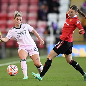 Manchester United vs. Arsenal: Women's Super League Clash - Arsenal's Laura Wienroither Fends Off Hannah Blundell