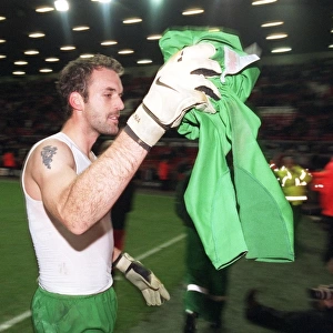 Manuel Almunia (Arsenal) throws his shirt to the fans after the match