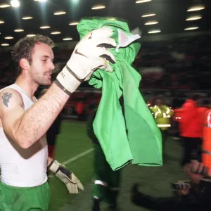 Manuel Almunia (Arsenal) throws his shirt to the fans after the match