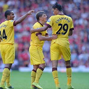 Marouane Chamakh, Andrey Arshavin and Theo Walcott celebrate the Arsenal goal