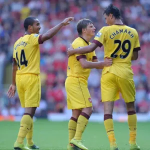 Marouane Chamakh, Andrey Arshavin and Theo Walcott celebrate the Arsenal goal Marouane Chamakh, Andrey Arshavin and Theo Walcott celebrate the Arsenal goal