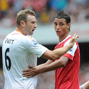 Marouane Chamakh (Arsenal) and Ian Evatt (Blackpool). Arsenal 6: 0 Blackpool