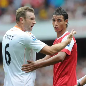 Marouane Chamakh (Arsenal) and Ian Evatt (Blackpool). Arsenal 6: 0 Blackpool Marouane Chamakh (Arsenal) and Ian Evatt (Blackpool). Arsenal 6: 0 Blackpool