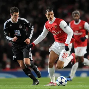 Marouane Chamakh (Arsenal) Radosav Petrovic (Partizan). Arsenal 3: 1 Partizan Belgrade Marouane Chamakh (Arsenal) Radosav Petrovic (Partizan). Arsenal 3: 1 Partizan Belgrade