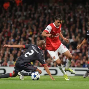 Marouane Chamakh breaks past Braga defender Alberto Rodriguez to score the 3rd Arsenal goal