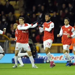 Marouane Chamakh celebrates scoring his and Arsenals 1st goal with Sebastien Squillaci