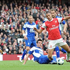 Marouane Chamakh is tripped by Scott Dann (Birmingham) for the Arsenal penalty