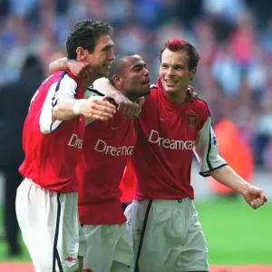 Martin Keown, Ashley Cole and Fredrik Ljungberg celebrate after the match Martin Keown, Ashley Cole and Fredrik Ljungberg celebrate after the match