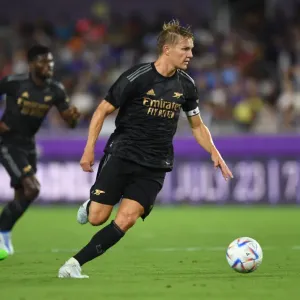 Martin Odegaard in Action: Arsenal's Pre-Season Battle at Orlando City SC (2022-23) Martin Odegaard in Action: Arsenal's Pre-Season Battle at Orlando City SC (2022-23)