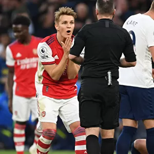 Martin Odegaard Appeals to Referee during Intense Tottenham vs. Arsenal Premier League Clash