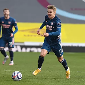 Martin Odegaard Shines in Empty Turf Moor: Arsenal's Triumph over Burnley in the Premier League Amidst COVID-19 Restrictions, March 2021