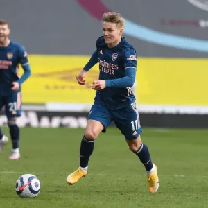 Martin Odegaard Shines in Empty Turf Moor: Arsenal's Triumph over Burnley in the Premier League Amidst COVID-19 Restrictions, March 2021