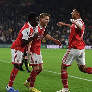 Martin Odegaard and Team Celebrate First Goal: Wolverhampton Wanderers vs. Arsenal FC, Premier League 2022-23
