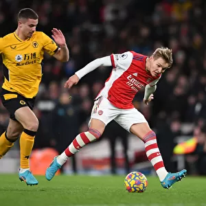 Martin Odegaard vs. Leander Dendoncker: Intense Rivalry in Arsenal vs. Wolverhampton Wanderers Premier League Clash