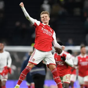 Martin Odegaard's Celebration: Arsenal's Victory Over Tottenham Hotspur in the Premier League (2022-23) Martin Odegaard's Celebration: Arsenal's Victory Over Tottenham Hotspur in the Premier League (2022-23)