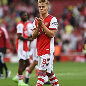 Martin Odegaard's Euphoric Celebration with Arsenal Fans: Triumph over Norwich City
