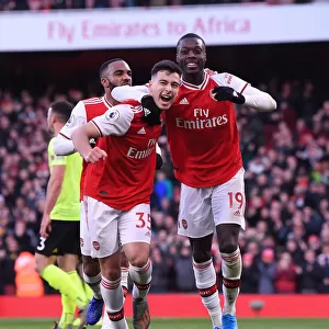 Martinelli and Pepe's Jubilant Moment: Arsenal's Thrilling Victory over Sheffield United (2019-20)