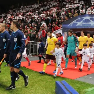 The match officials lead out the teams lead by Arsenal captain Cesc Fabregas The match officials lead out the teams lead by Arsenal captain Cesc Fabregas