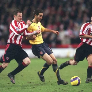 Matthieu Flamini (Arsenal) Alan Quin y Nick Montgomery (Sheffield United) Matthieu Flamini (Arsenal) Alan Quin y Nick Montgomery (Sheffield United)
