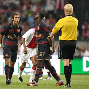 Mathieu Flamini (Arsenal) argues with the referee