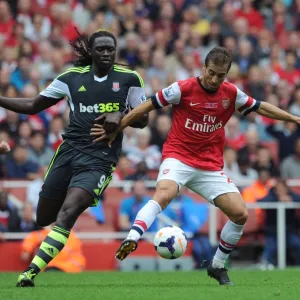 Mathieu Flamini (Arsenal) Kenwyne Jones (Stoke). Arsenal 3: 1 Stoke City. Barclays Premier League