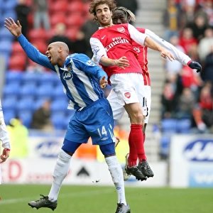 Mathieu Flamini and Bacary Sagna (Arsenal) Marlon King (Wigan)