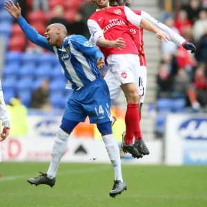 Mathieu Flamini and Bacary Sagna (Arsenal) Marlon King (Wigan)