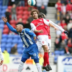 Mathieu Flamini and Bacary Sagna (Arsenal) Marlon King (Wigan) Mathieu Flamini and Bacary Sagna (Arsenal) Marlon King (Wigan)