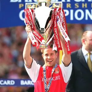 Matthew Upson lifts the F. A. Barclaycard Premiership Trophy