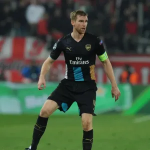 Per Mertesacker in Action: Arsenal vs. Olympiacos, UEFA Champions League, Athens 2015 Per Mertesacker in Action: Arsenal vs. Olympiacos, UEFA Champions League, Athens 2015