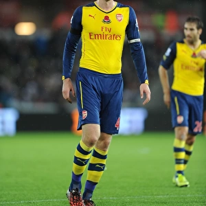 Per Mertesacker of Arsenal in Action against Swansea City (2014-15)