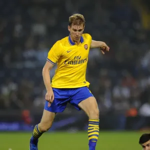 Per Mertesacker of Arsenal in Action against West Bromwich Albion - Capital One Cup, 2013 Per Mertesacker of Arsenal in Action against West Bromwich Albion - Capital One Cup, 2013