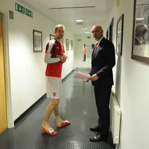 Per Mertesacker (Arsenal) with Assistant Manager Steve Bould before the match. Arsenal 0 Per Mertesacker (Arsenal) with Assistant Manager Steve Bould before the match. Arsenal 0