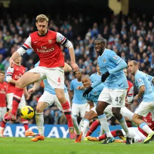 Per Mertesacker (Arsenal) Yaya Toure (Man City). Manchester City 6: 3 Arsenal. Barclays