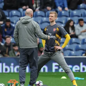 Mertesacker and Bould in Deep Discussion: Arsenal's Defensive Strategy Amidst West Brom's 3:1 Victory