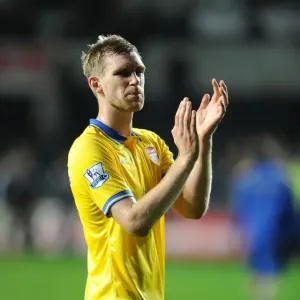 Per Mertesacker Celebrates with Arsenal Fans after Swansea Victory, 2013-14 Premier League Per Mertesacker Celebrates with Arsenal Fans after Swansea Victory, 2013-14 Premier League