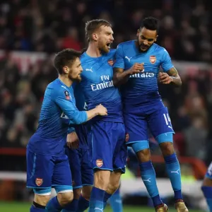 Per Mertesacker, Debuchy, and Walcott's Goal Celebration: Arsenal Triumphs Over Nottingham Forest in FA Cup Third Round Per Mertesacker, Debuchy, and Walcott's Goal Celebration: Arsenal Triumphs Over Nottingham Forest in FA Cup Third Round