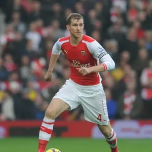 Per Mertesacker Focuses in Arsenal's Premier League Clash Against West Bromwich Albion (2014)