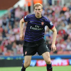 Per Mertesacker Focuses in Stoke City vs Arsenal Premier League Clash (2012-13) Per Mertesacker Focuses in Stoke City vs Arsenal Premier League Clash (2012-13)