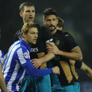 Per Mertesacker and Olivier Giroud vs. Glenn Loovens: A Capital One Cup Showdown